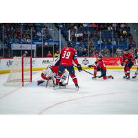 Springfield Thunderbirds center Matthew Peca (right) rips a shot