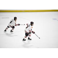 Rapid City Rush forward Simon Boyko (left) and defenseman Zack Hoffman