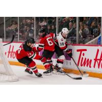 Belleville Senators defenceman Wyatte Wylie (right) against the Utica Comets